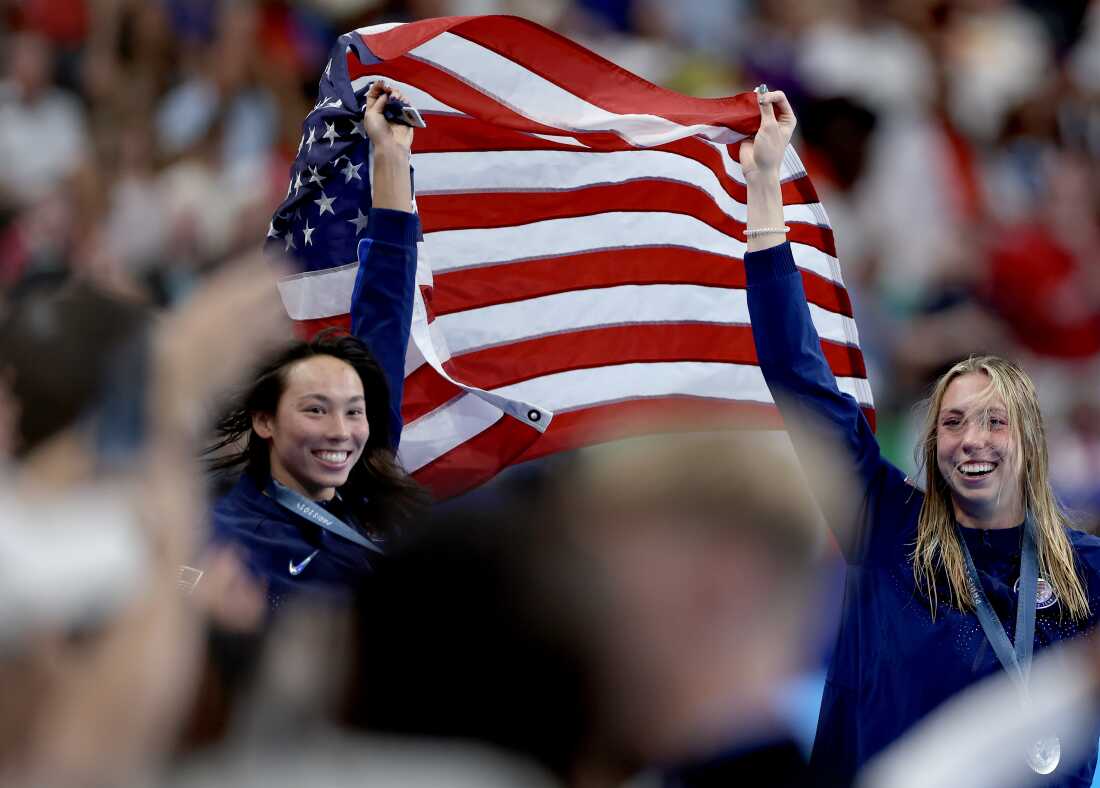 Gold medalist Torri Huske and silver medalist Gretchen Walsh of the United States celebrate after their 1-2 finish in the women's 100-meter butterfly final at the 2024 Olympic Games at Pari