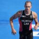 Tyler Mislawchuk runs during the triathlon