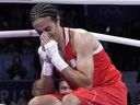 Algeria's Imane Khelif reacts after defeating Hungary's Anna Hamori in their women's 66kg quarterfinal boxing match at the 2024 Summer Olympics.