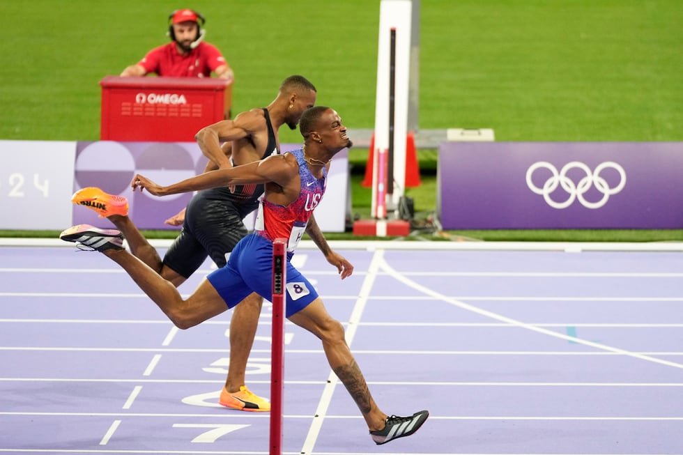 Quincy Hall, of the United States, crosses the finish line followed by Matthew Hudson-Smith,...