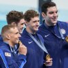 The United States men's 4x100-meter freestyle relay team celebrate after winning the gold medal at the 2024 Summer Olympics on Saturday in Nanterre, France.