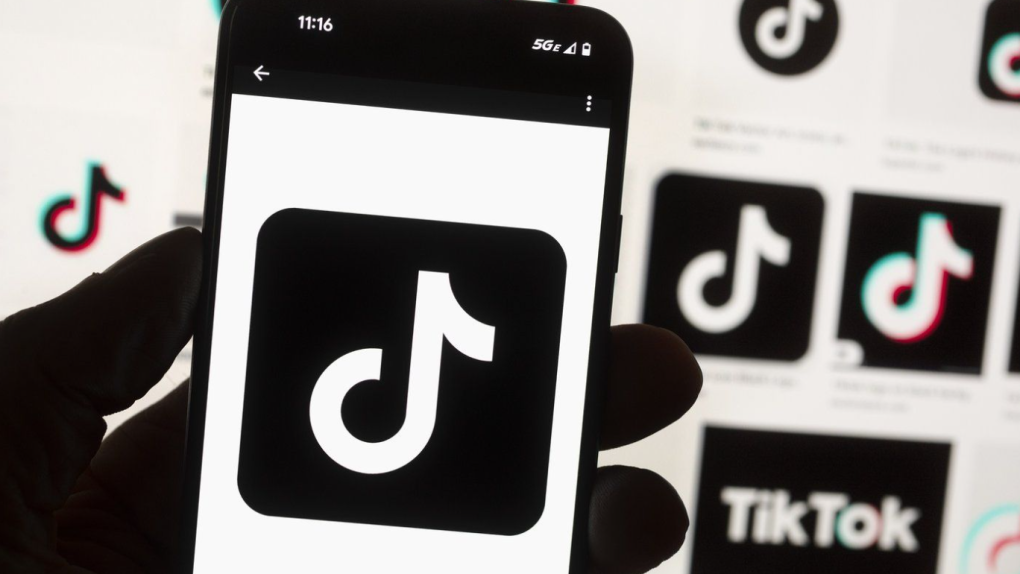 The TikTok logo is displayed on a mobile phone in front of a computer screen, Oct. 14, 2022, in Boston. (Michael Dwyer / AP Photo, File)