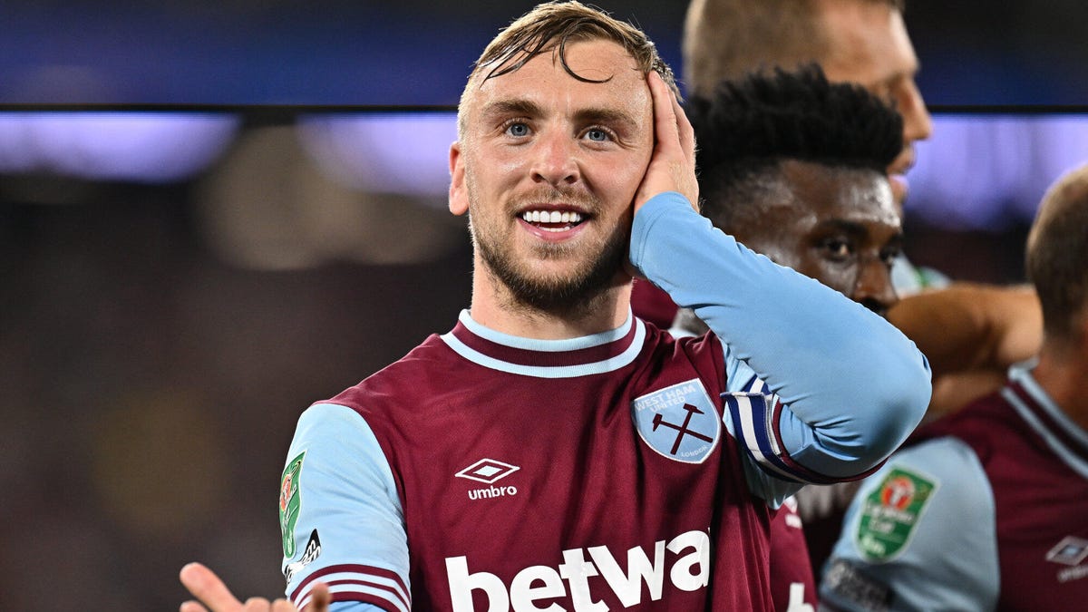 West Ham forward Jarrod Bowen celebrating, smiling, making gesture with his left hand on his left ear.