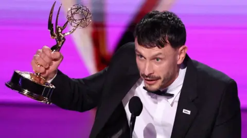 Reuters Richard Gadd holding his Emmy Award aloft