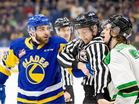 Saskatoon Blades defenceman John Babcock (55) takes on Prince Albert Raiders during game one of the WHL playoffs at SaskTel Centre. Photo taken in Saskatoon, Sask. on Thursday, March 28, 2024.