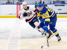 Saskatoon Blades defenceman John Babcock (55) take on the Regina Pats during WHL action at SaskTel Centre. Photo taken in Saskatoon, Sask. on Wednesday, January 31, 2024.