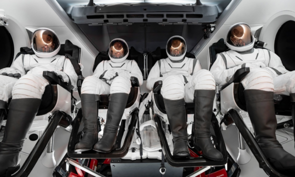 The four-person crew of the Polaris Dawn mission pictured wearing their SpaceX extravehicular activity suits