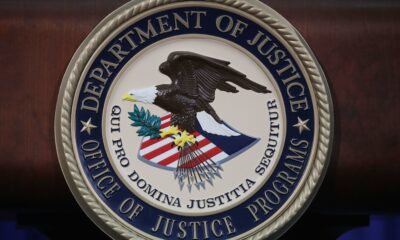 The Justice Department seal is seen on the lectern during a Hate Crimes Subcommittee summit on June 29, 2017 in Washington, DC. (Mark Wilson / Getty Images via CNN Newsource)