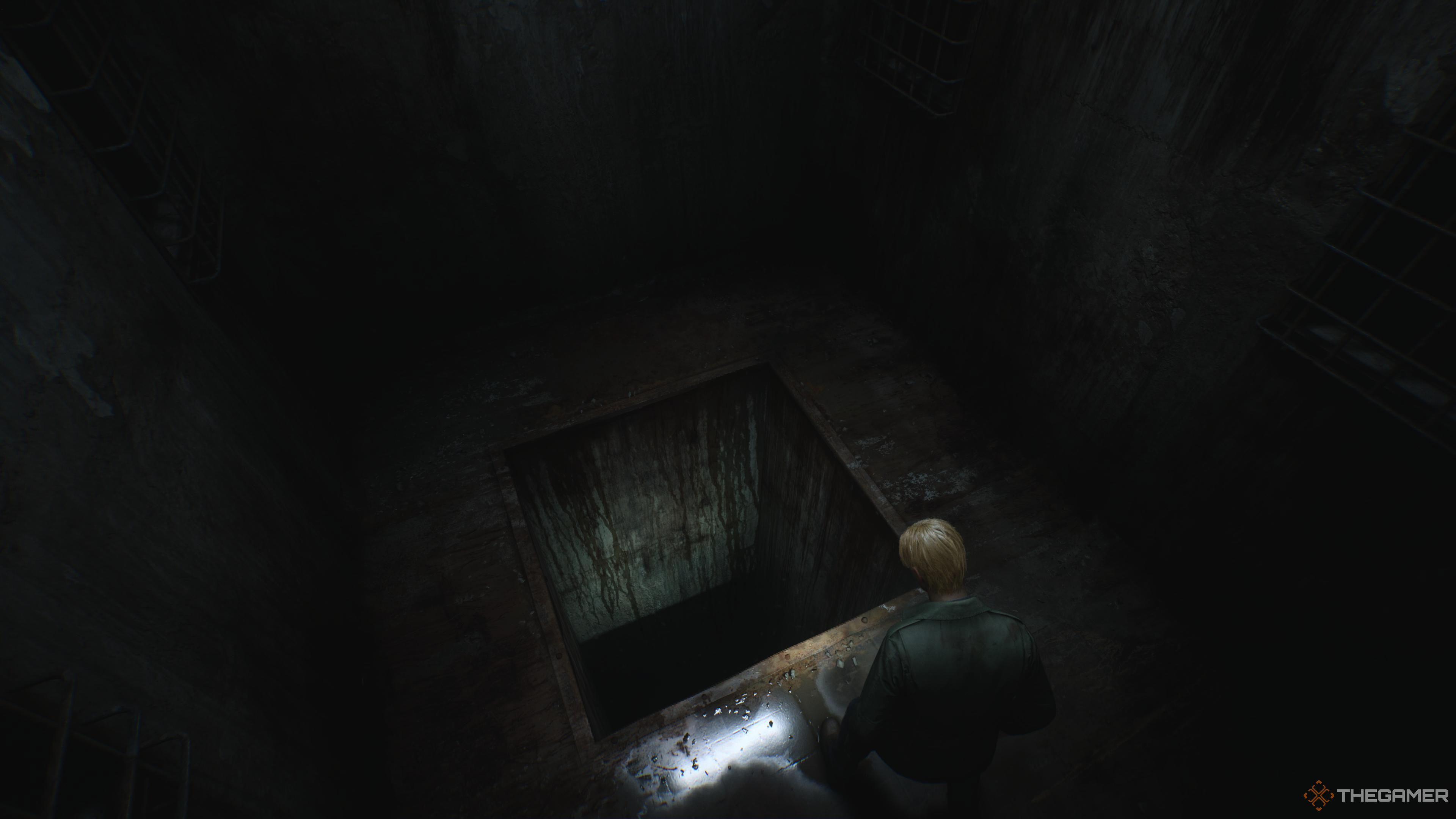 Silent Hill 2, James looking down into a massive hole.