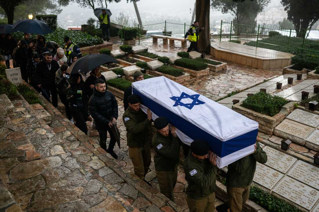 Israeli soldiers carry the casket of reservist Elkana Yehuda Sfez, who was killed in combat in Gaza, during his funeral at the Mount Herzl military cemetery in Jerusalem, on Jan. 23.