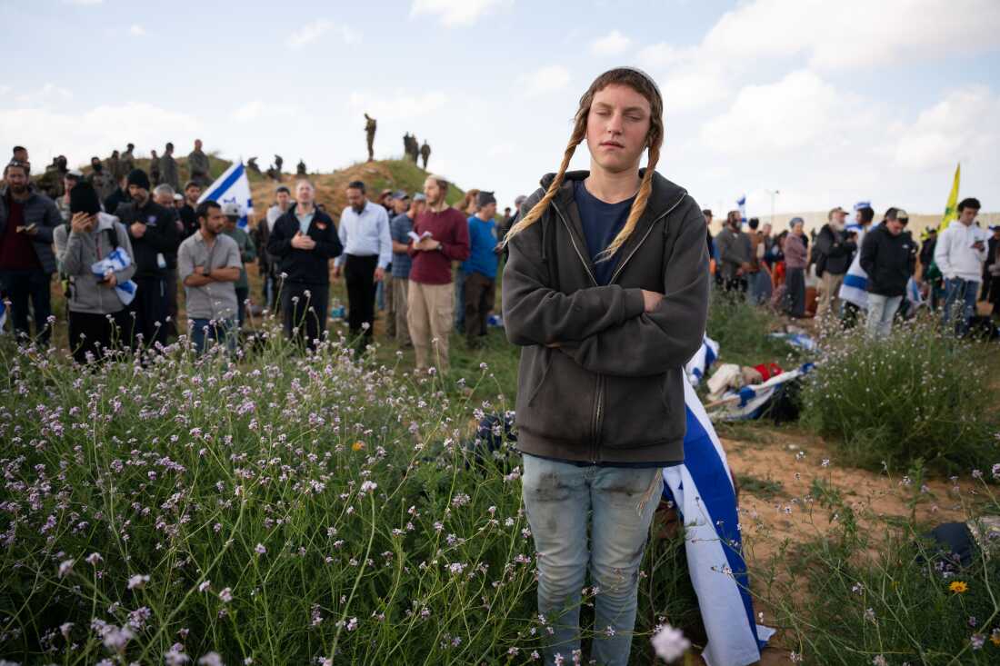 Israeli protesters attempt to block the road as aid trucks cross into the Gaza Strip, as Israeli border police watch over them, at the Kerem Shalom border crossing, southern Israel, Jan. 29.