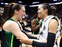 Bridget Carleton, left, and Napheesa Collier of the Minnesota Lynx celebrate their victory against the Connecticut Sun after Game 5 of the semifinal during the WNBA playoffs at Target Center on Oct. 8, 2024, in Minneapolis, Minn. (David Berding/Getty Images)