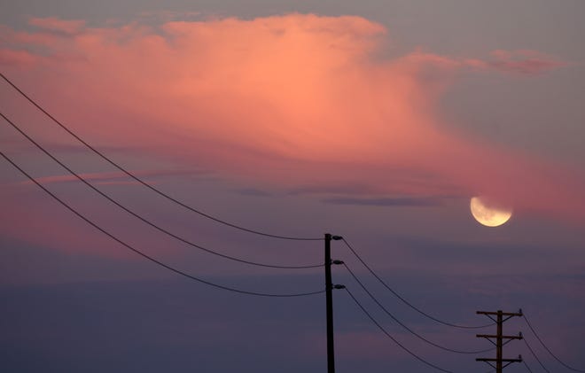 The hunter's supermoon rises on October 16, 2024 near Lancaster, California. The hunter's moon is the largest and brightest of four supermoons this year, reaching its nearest distance to the Earth at around 222,055 miles away.