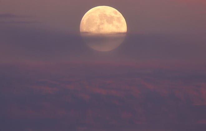 The hunter's supermoon rises on October 16, 2024 near Lancaster, California. The Hunter's Moon is the largest and brightest of four supermoons this year, reaching its nearest distance to the Earth at around 222,055 miles away.