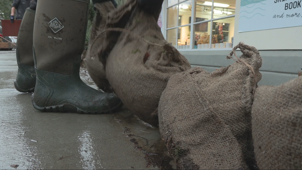 Deep Cove businesses cleaning up after flood