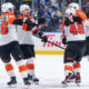 Frost scores shootout winner for Flyers in season opener against Canucks