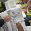 Workers at the Wake County Board of Elections prepare to mail absentee ballots in September in Raleigh, N.C. 