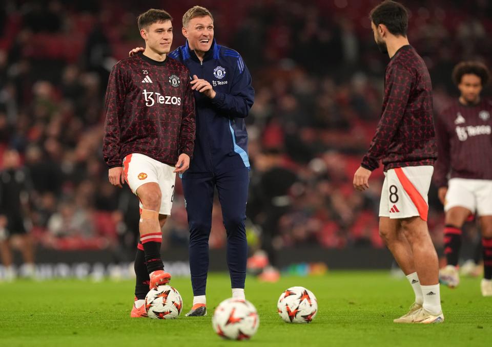 Coach Darren Fletcher and midfielder Manuel Ugarte speak to captain Bruno Fernandes (Martin Rickett/PA Wire)