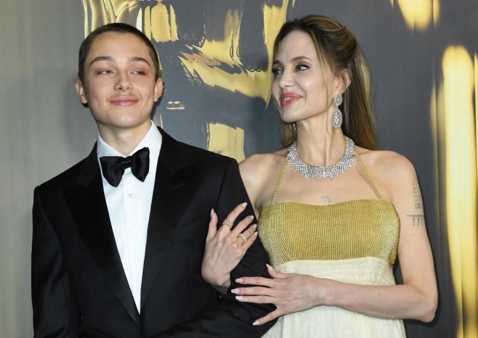 Knox Jolie-Pitt and Angelina Jolie on the Governors Awards red carpet. AFP via Getty Images