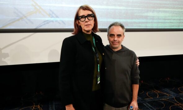 Director Joel Souza, right, and cinematographer Bianca Cline pose for media after the premiere of the film 'Rust' during the 32nd Camerimage International Film Festival in Torun, Poland, Nov. 20, 2024. (AP Photo/Czarek Sokolowski)