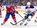 Canadiens' Brendan Gallagher shoots the puck past the Oilers' Travis Dermott during game at the Bell Centre on Monday.