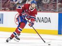 Canadiens' Lane Hutson skates the puck across the blue line during the second period against the Edmonton Oilers in Montreal Monday Nov. 18, 2024. 