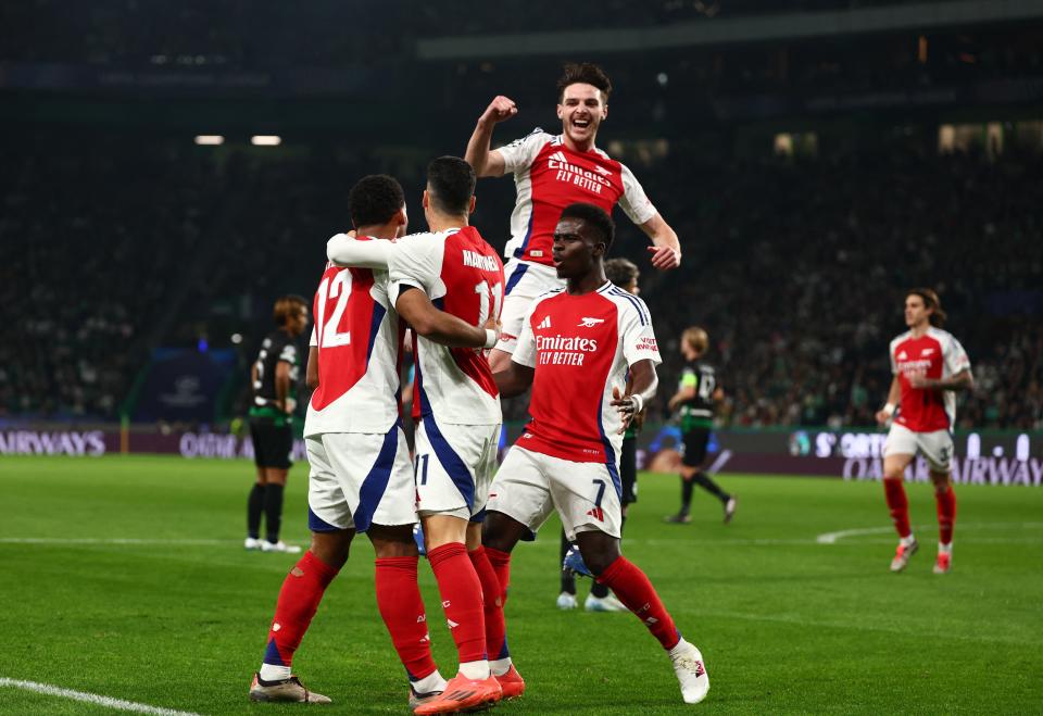 Arsenal players celebrate after scoring the opener (Reuters)