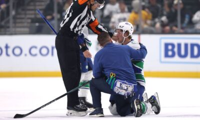 Canucks' Boeser leaves vs. Kings after illegal check to head