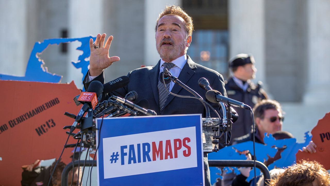 In this March 26, 2019, file photo former California Gov. Arnold Schwarzenegger speaks at a rally calling for "Fair Maps" at the Supreme Court in Washington. (AP Photo/Carolyn Kaster)