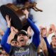 Los Angeles Dodgers' Freddie Freeman celebrates with the MVP trophy after their win against the New York Yankees in Game 5 to win the baseball World Series, Oct. 31, 2024, in New York. (AP Photo/Ashley Landis)