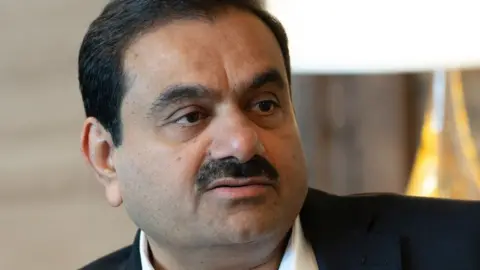 Getty Images Gautam Adani, chairman of Adani Group, during a Bloomberg Television interview at the company's headquarters in Ahmedabad, Gujarat, India, on Saturday, May 25, 2024. Gautam Adani says he'll shift control to his scions in the early 2030s.