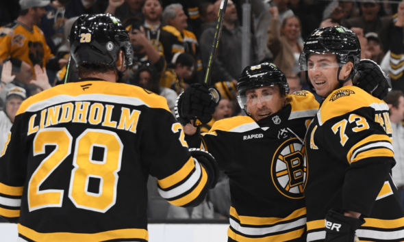 Marchand scores late in OT, Bruins recover to defeat Flames