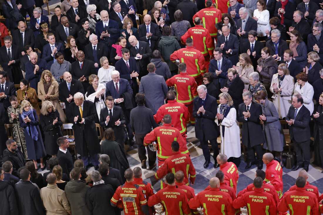 Firefighters, rescuers and builders involved in the restoration of Notre-Dame Cathedral parade during a ceremony to mark the re-opening of landmark cathedral, in central Paris, on December 7, 2024. Around 50 heads of state and government are expected in the French capital to attend the ceremony marking the rebuilding of the Gothic masterpiece five years after the 2019 fire which ravaged the world heritage landmark and toppled its spire. Some 250 companies and hundreds of experts were part of the five-year restoration project at a cost of hundreds of millions of euros. (Photo by Ludovic MARIN / POOL / AFP) (Photo by LUDOVIC MARIN/POOL/AFP via Getty Images)