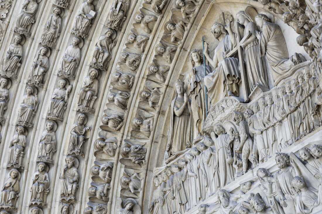 TOPSHOT - This photograph shows part of bas-relief outside of Notre-Dame de Paris cathedral in Paris, on November 29, 2024. The Notre-Dame Cathedral is set to re-open early December 2024, with a planned weekend of ceremonies on December 7 and 8, 2024, five years after the 2019 fire which ravaged the world heritage landmark and toppled its spire. Some 250 companies and hundreds of experts were mobilised for the five-year restoration costing hundreds of millions of euros. (Photo by STEPHANE DE SAKUTIN / POOL / AFP) (Photo by STEPHANE DE SAKUTIN/POOL/AFP via Getty Images)