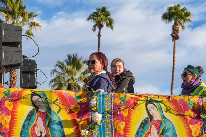 Participants in the Virgen de Guadalupe pilgrimage ride in the back of a vehicle in Palm Springs, Calif., Dec. 12, 2024.