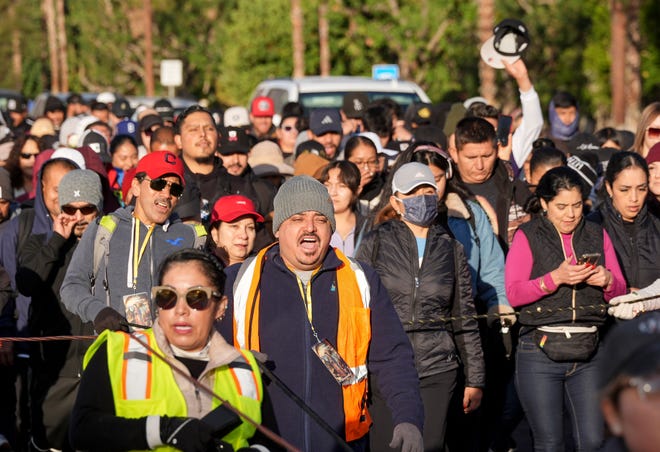 Catholics sing as they walk in the Virgen de Guadalupe pilgrimage in the morning along Hwy 111 in Palm Springs, Calif., Dec. 12, 2024.