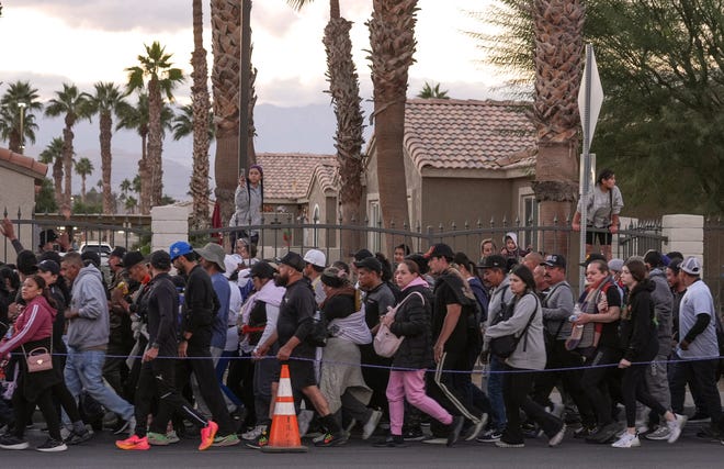 Participants in the Virgen de Guadalupe pilgrimage make their way through Indio in the late afternoon in California, Dec. 12, 2024.