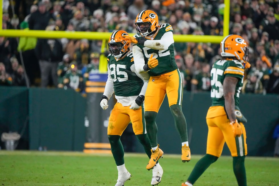 Green Bay Packers defensive tackle Devonte Wyatt (95) celebrates his sack with defensive end...