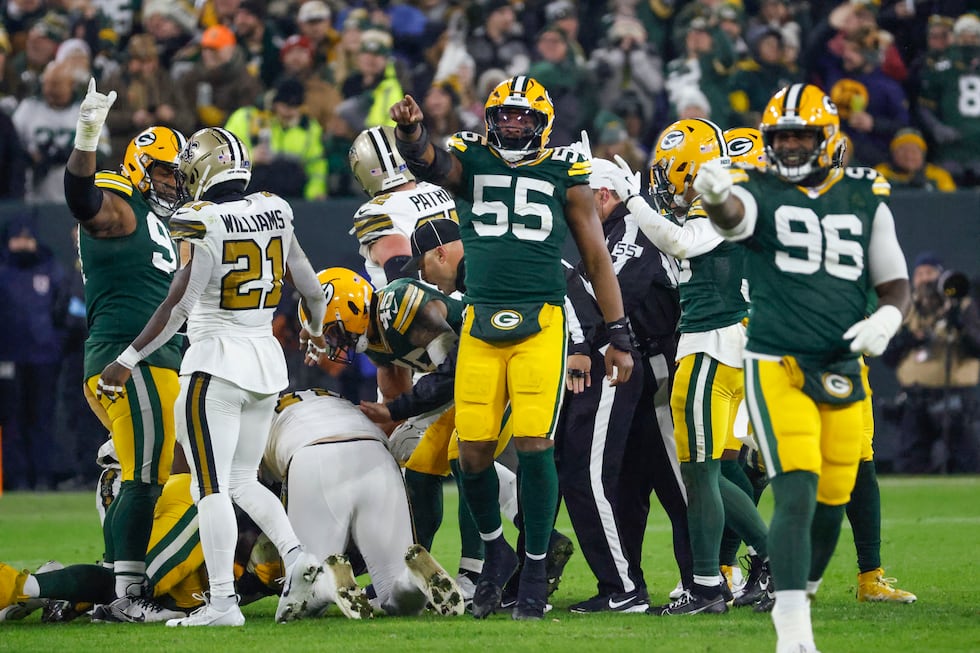 Green Bay Packers defensive end Kingsley Enagbare (55) and defensive tackle Colby Wooden (96)...