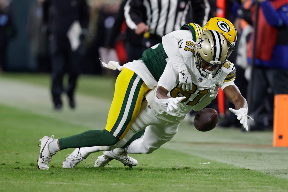 New Orleans Saints wide receiver Kevin Austin Jr. (81) drops the ball as he is hit by Green...