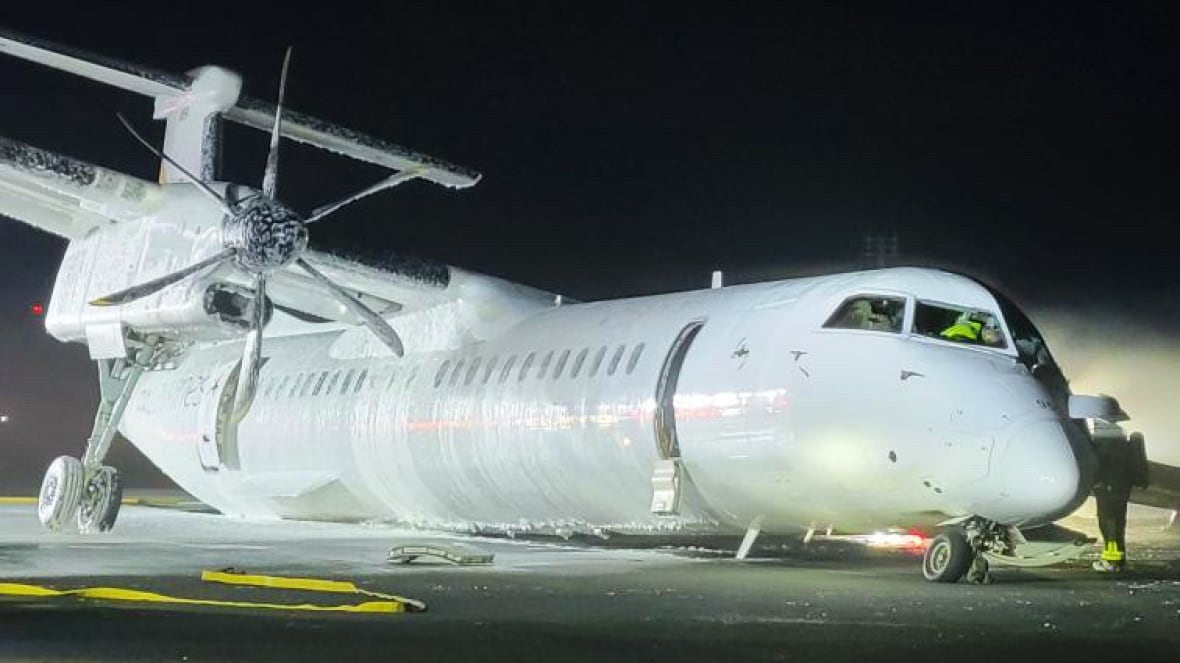 A plane sits on a runway