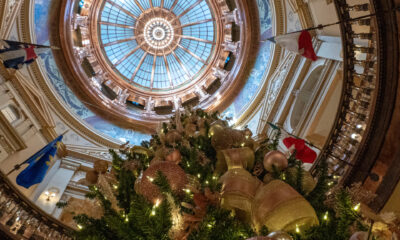 A Christmas tree stands underneath the Kansas Statehouse dome Dec. 4, 2024.