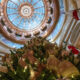 A Christmas tree stands underneath the Kansas Statehouse dome Dec. 4, 2024.