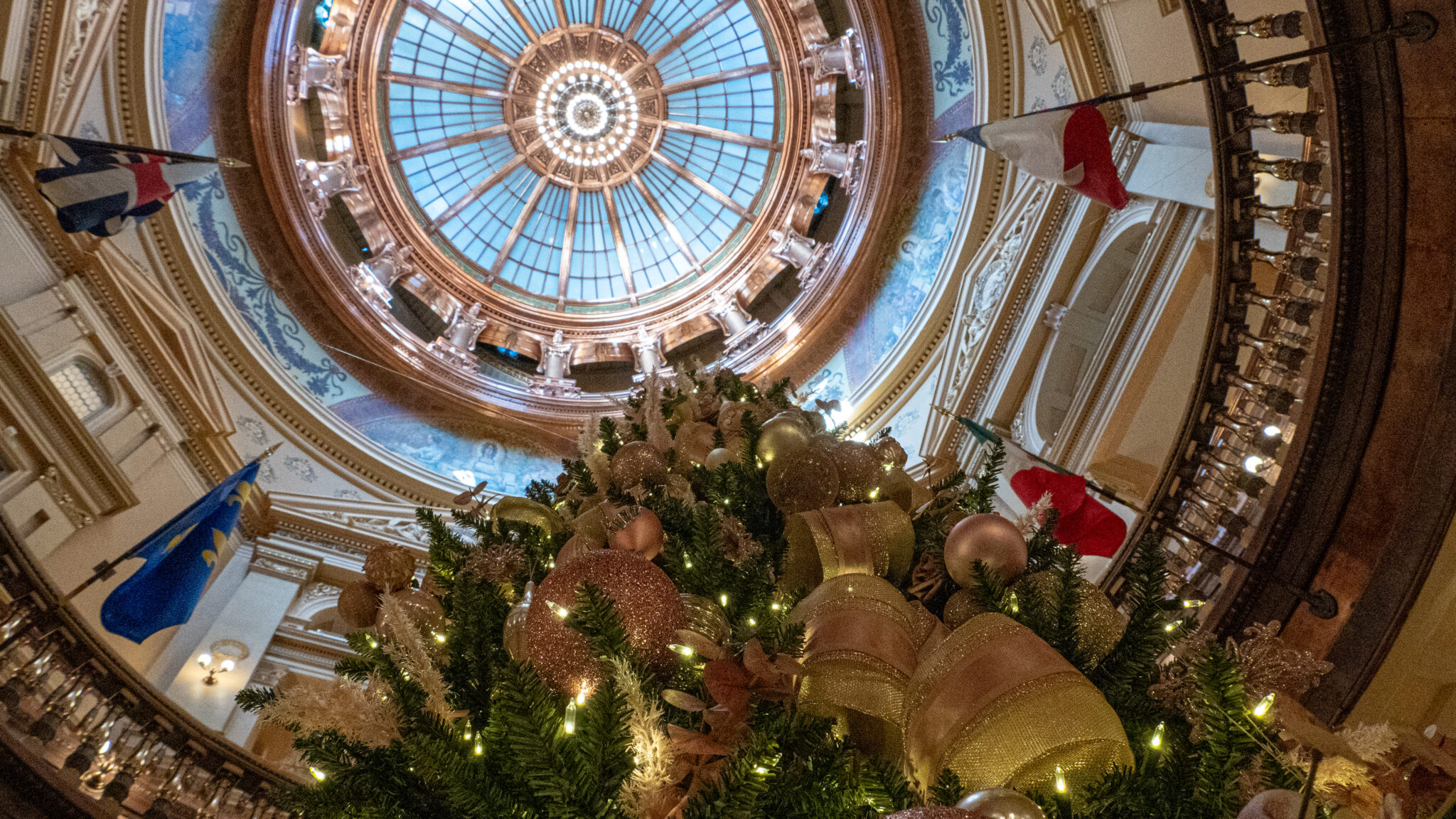 A Christmas tree stands underneath the Kansas Statehouse dome Dec. 4, 2024.