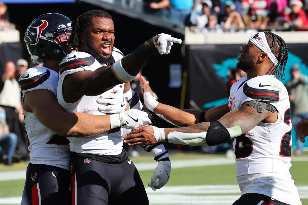 JACKSONVILLE, FLORIDA - DECEMBER 01: Azeez Al-Shaair #0 of the Houston Texans points to the Jacksonville Jaguars bench after a fight and being ejected during the second quarter of a game at EverBank Stadium on December 01, 2024 in Jacksonville, Florida. (Photo by Mike Carlson/Getty Images)