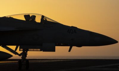 A fighter jet maneuvers on the deck of the USS Dwight D. Eisenhower in the Red Sea.