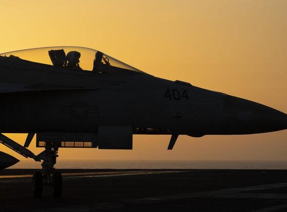 A fighter jet maneuvers on the deck of the USS Dwight D. Eisenhower in the Red Sea.