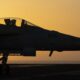 A fighter jet maneuvers on the deck of the USS Dwight D. Eisenhower in the Red Sea.