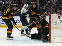 Daniel Sprong of the Seattle Kraken celebrates after teammate Jaden Schwartz scored a goal against Canuck goalie Thatcher Demo  during the third period  on Dec. 28, 2024, at Rogers Arena.