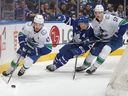 Canucks captain Quinn Hughes easily eludes pressure from the Maple Leafs on Saturday during 3-0 victory in Toronto.